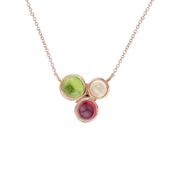 Rose gold multi-gemstone necklace. Three brightly coloured; moonstone, peridot and garnet gems set in 9ct rose gold. Attached to 9ct gold chain.