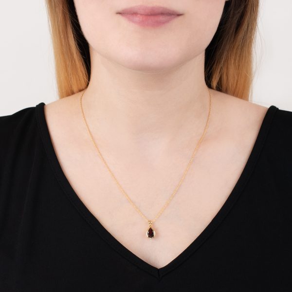Yellow gold garnet pear shape pendant